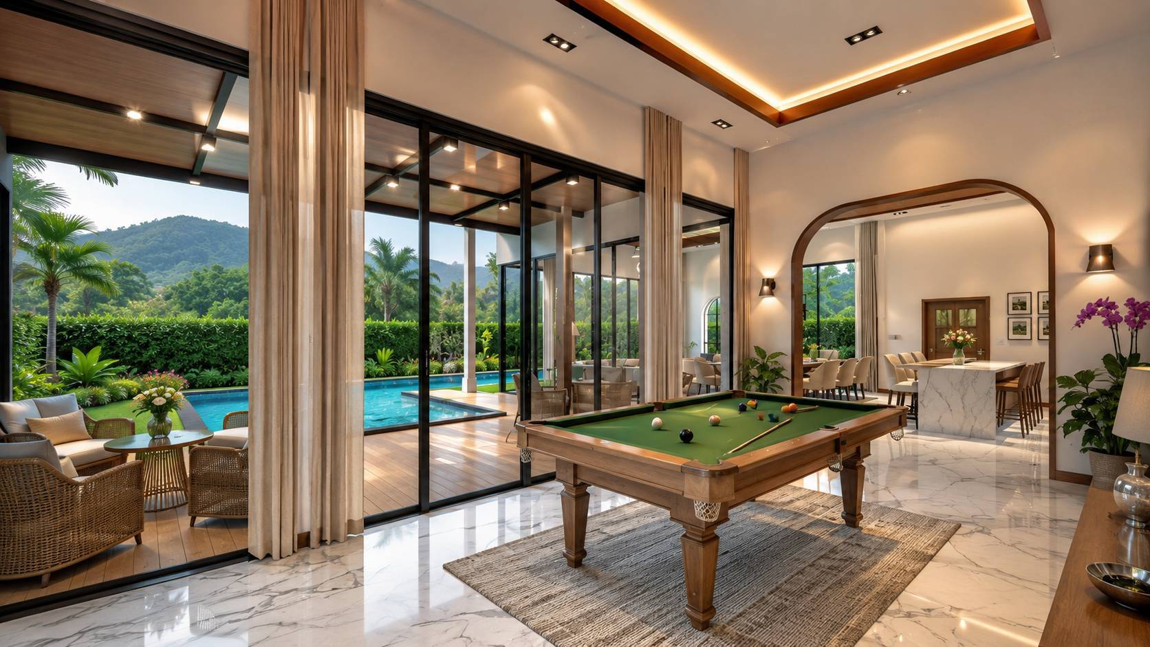 Games room with billiards table opening onto the pool terrace, tropical garden and mountains